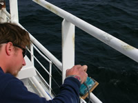 Matt Gibson sanding the hand rails on the upper deck