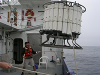 Chad handling the rosette of water collection bottles