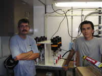 Eduardo and Luis working in the wet lab